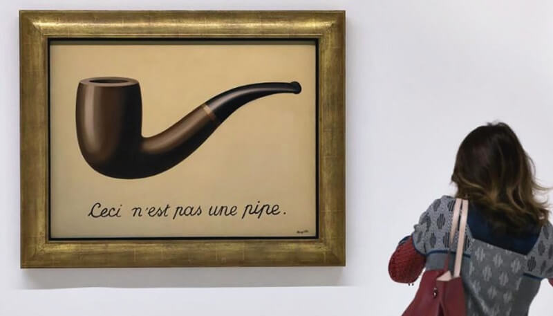 Photo of The Treachery of Images by Rene Magritte